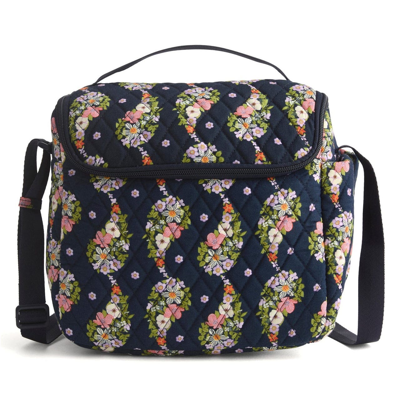 A quilted shoulder bag featuring a floral pattern on a dark background with an adjustable strap and top handle.