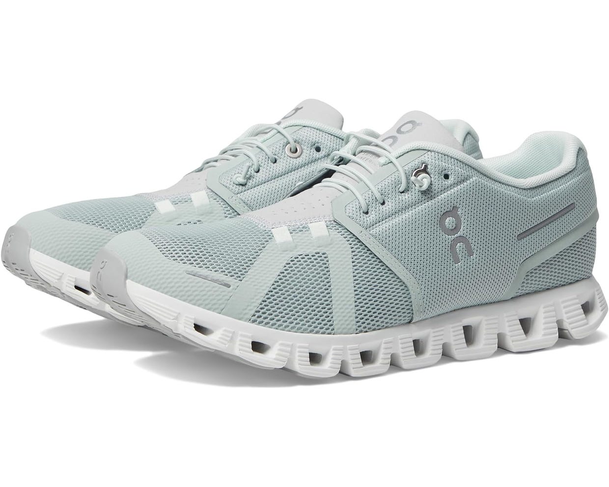 A pair of light blue running shoes with white soles.