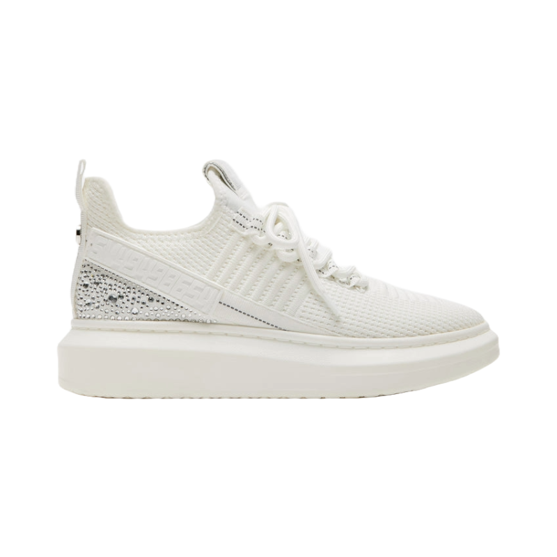 A white athletic sneaker with a textured design and embellishments on the side.