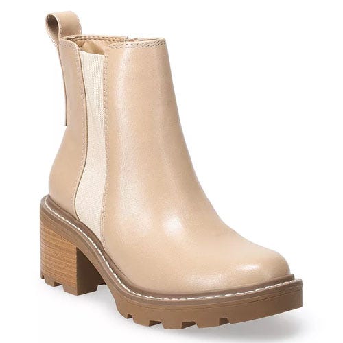 Beige chunky heel ankle boot with elastic side panels and a grooved rubber sole.
