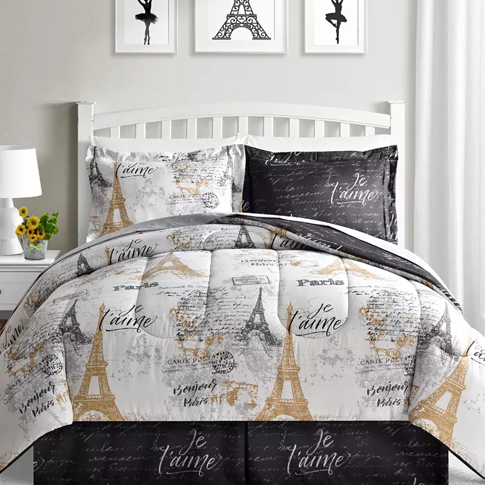 A Paris-themed bedding set with Eiffel Tower designs and French phrases in black, white, and gold colors.