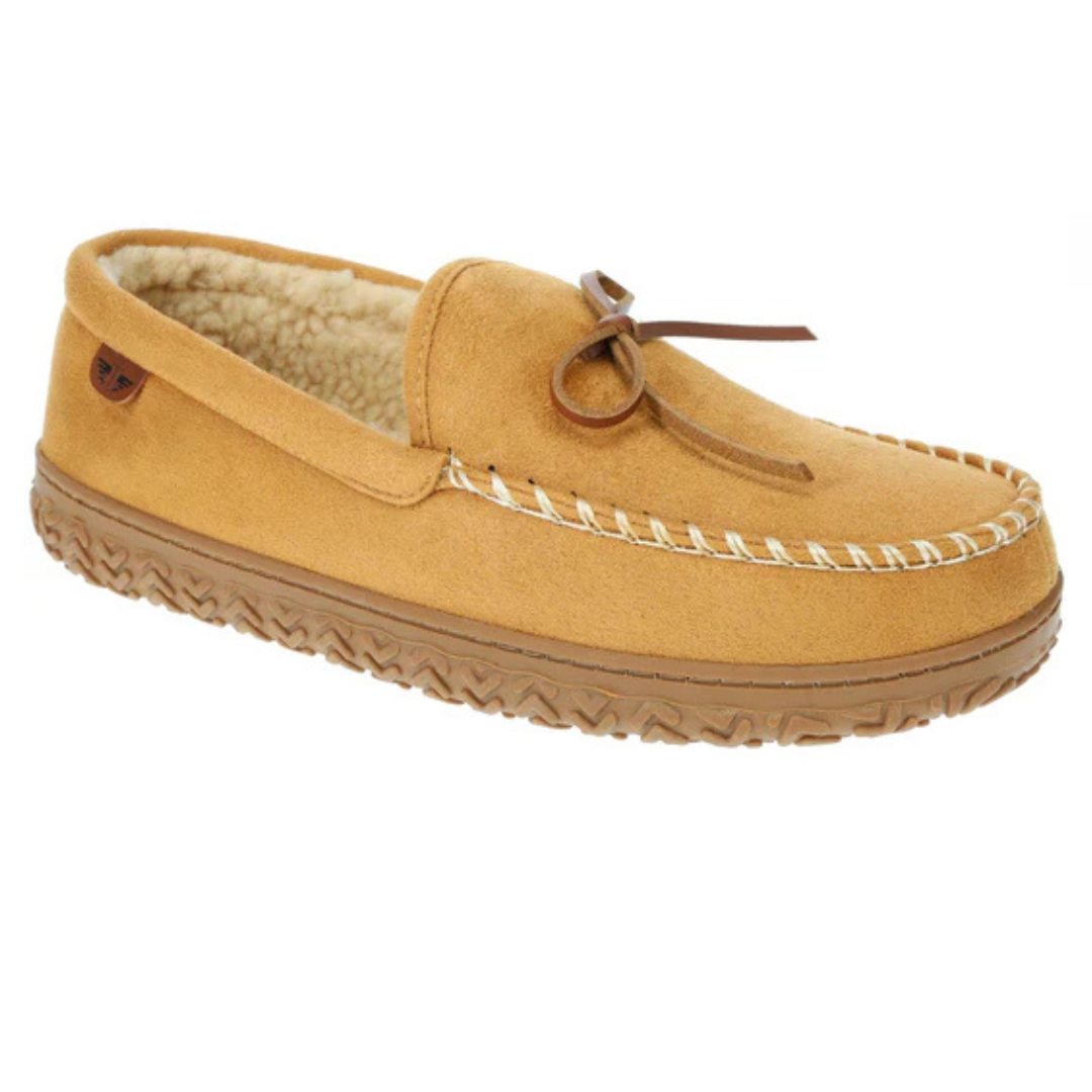 Tan slip-on moccasins with a soft suede exterior, white stitching, and a rubber sole. They feature a decorative leather bow and are lined with a plush, fleece-like material for comfort.