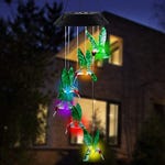 A wind chime with solar-powered LED lights, shaped like multiple colorful hummingbirds, hangs suspended, illuminating with varied hues.