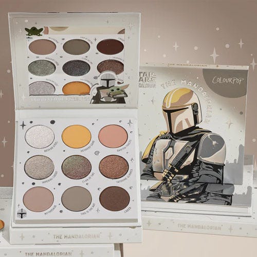ColourPop eyeshadow palette featuring a Star Wars: The Mandalorian theme with various shades and decorative packaging.