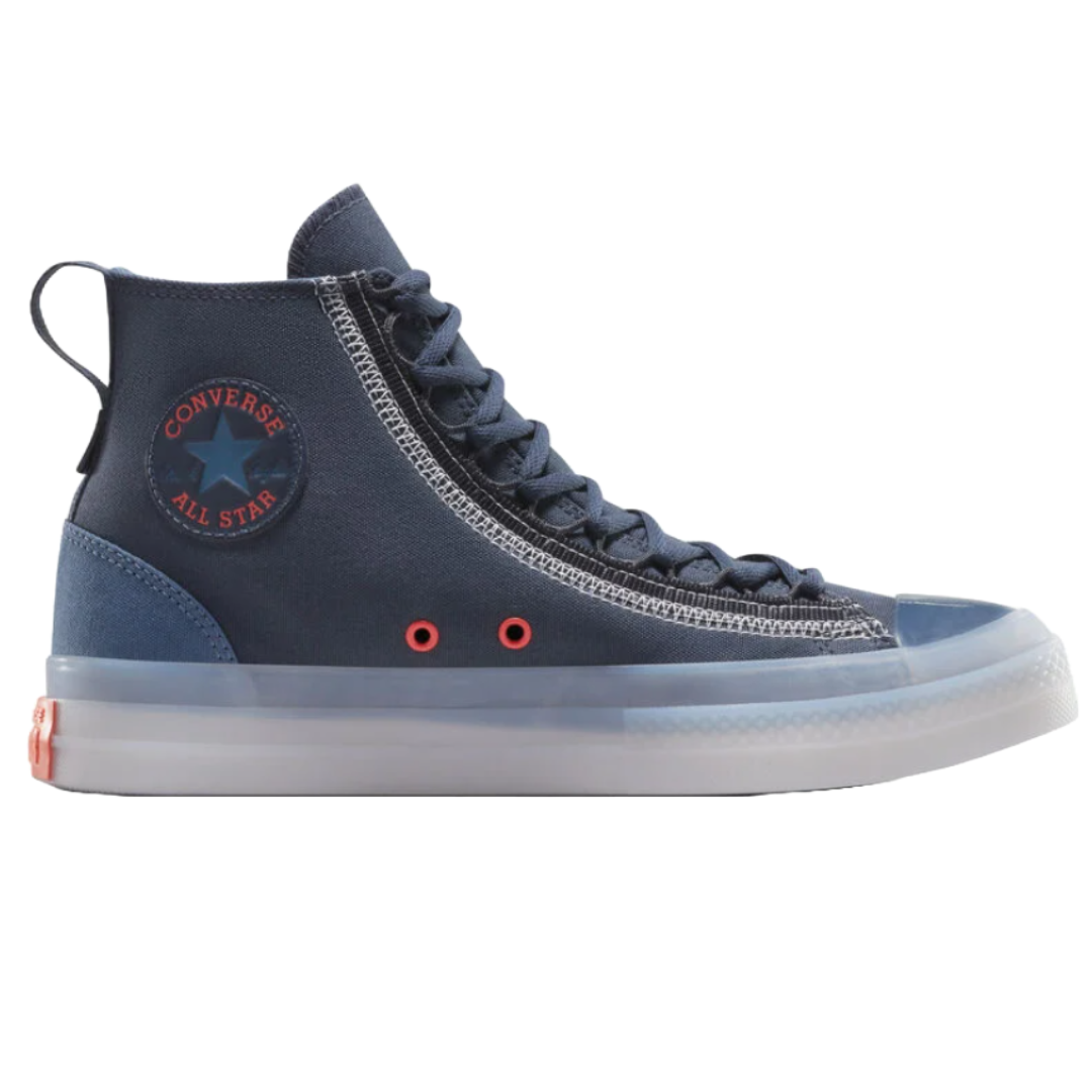High-top Converse All Star sneaker in navy blue with a translucent sole and red eyelets.