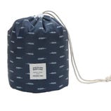 A drawstring bag with a blue and white arrow pattern, featuring a patch that reads \“Wind Blows, River Flows.\“