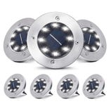 Round solar-powered LED ground lights with stainless steel frames, featuring multiple LED bulbs for outdoor use, likely for pathways or gardens.