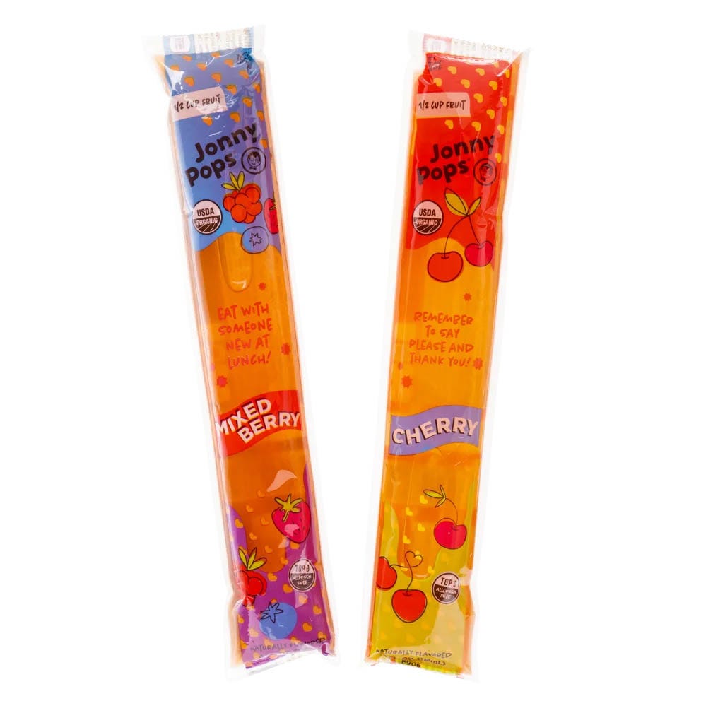 Jonny Pops organic freezer bars in mixed berry and cherry flavors. Each bar contains 1/2 cup of fruit and features motivational messages on the packaging.