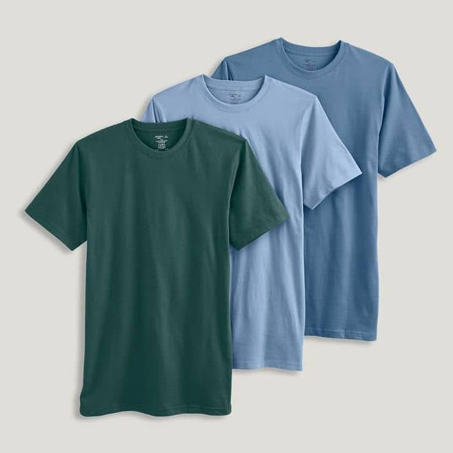 Three crew-neck T-shirts in dark green, light blue, and pale blue, presented on a plain background.