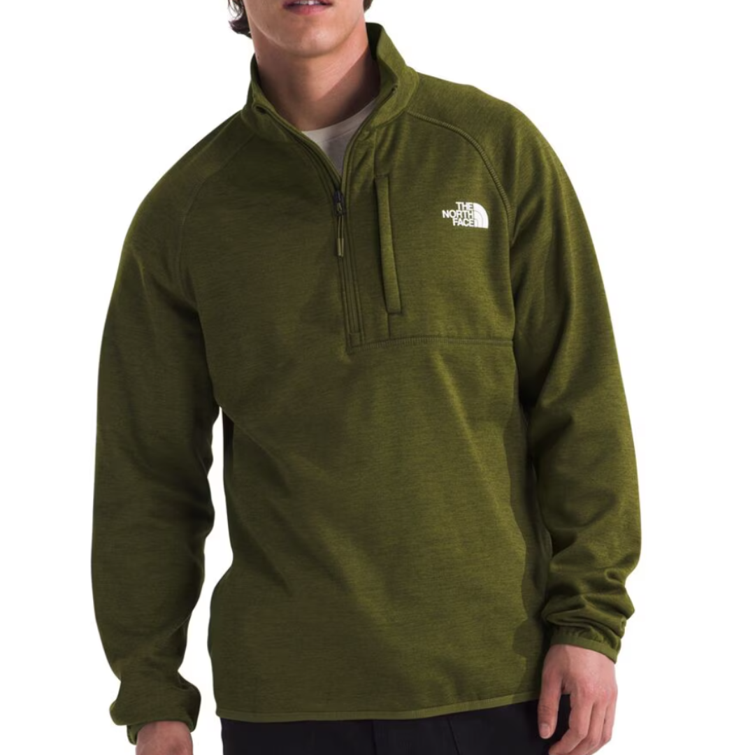Olive green pullover jacket with a half-zip front, featuring The North Face logo on the chest, long sleeves, and a casual fit.