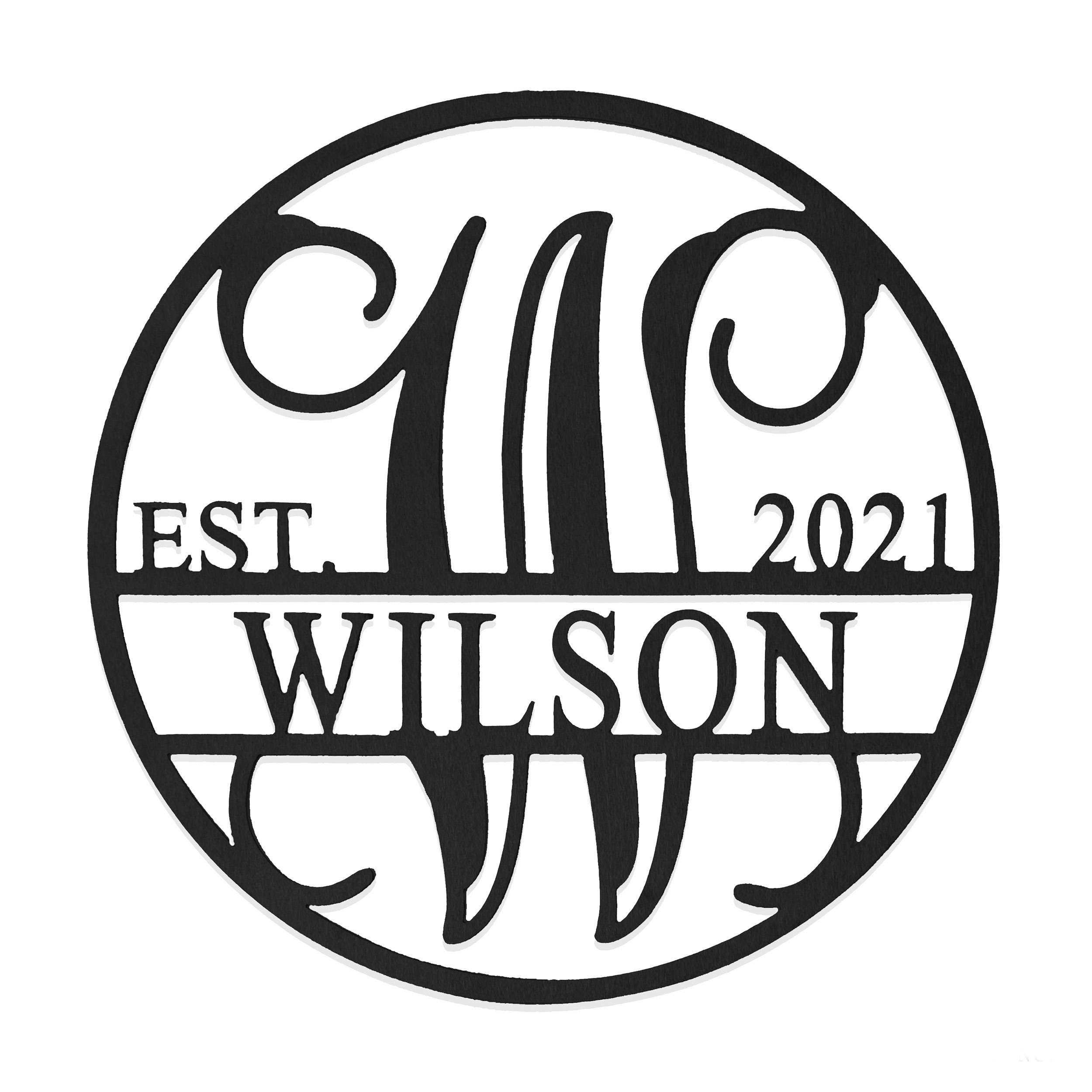 Circular metal sign featuring the year \“2021,\“ the name \“Wilson,\“ and the initials \“W\“ in a decorative font, indicating an establishment date.