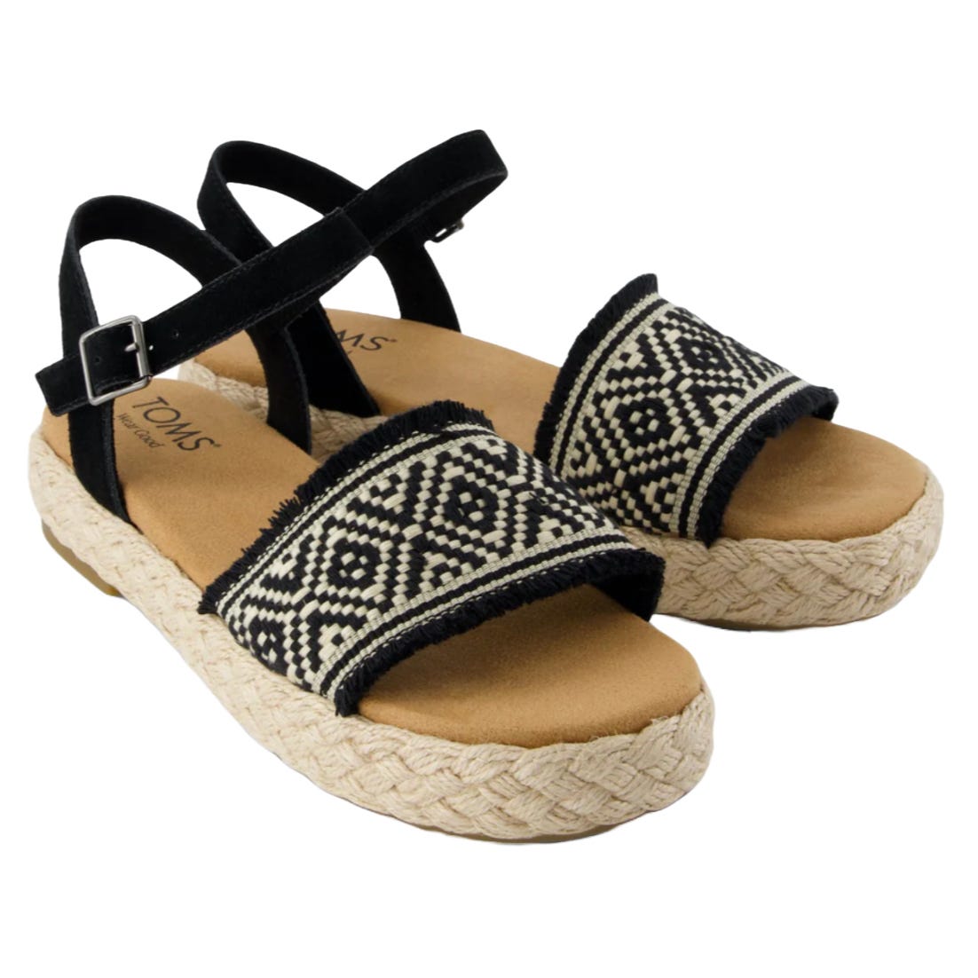 TOMS Espadrilles feature a woven jute platform sole, black ankle strap, and a front strap with an intricate black-and-white geometric pattern.