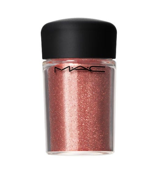 A clear bottle with black lid containing sparkly pink MAC cosmetic pigment.