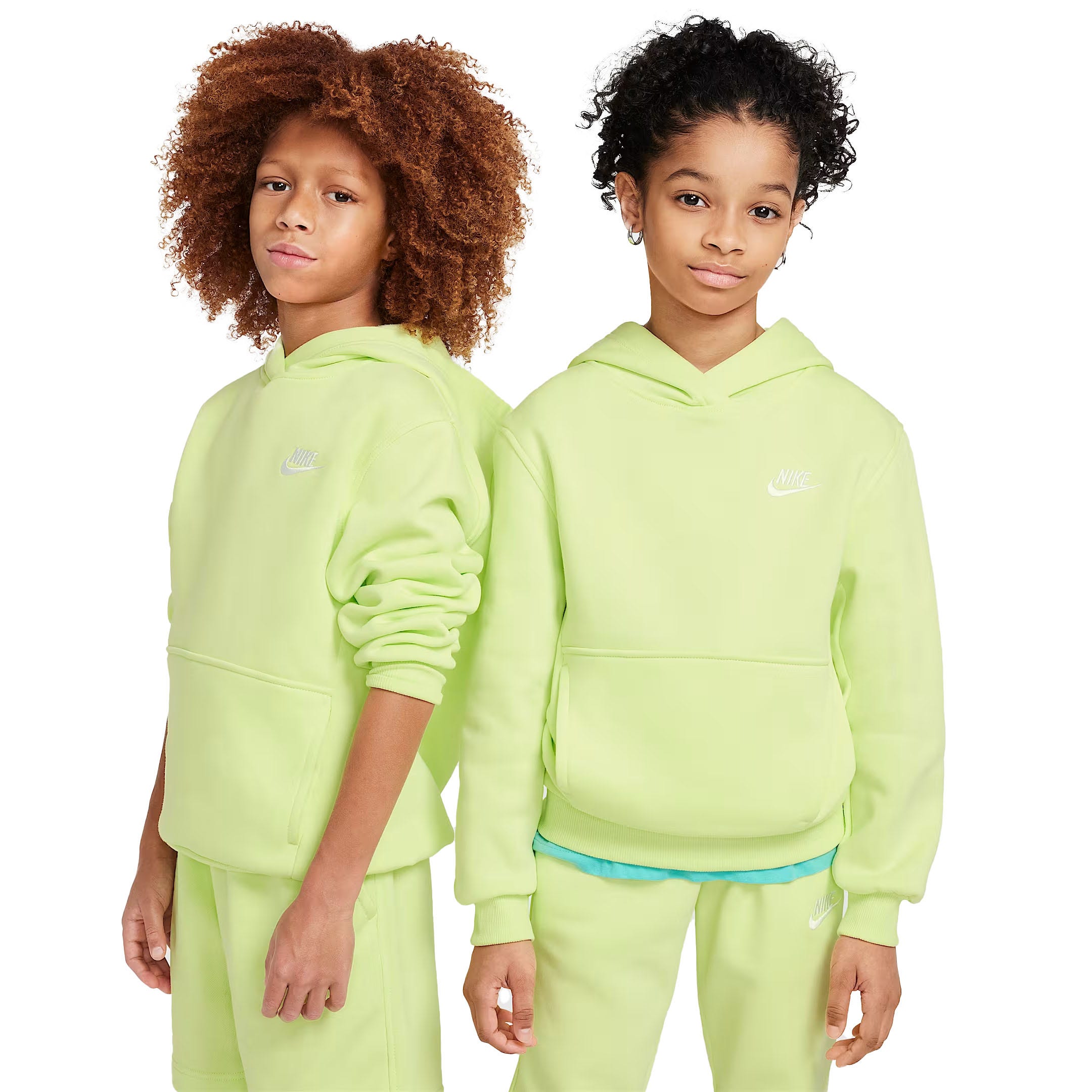 Two children wearing matching lime green Nike hoodies with front pockets and Nike shorts.