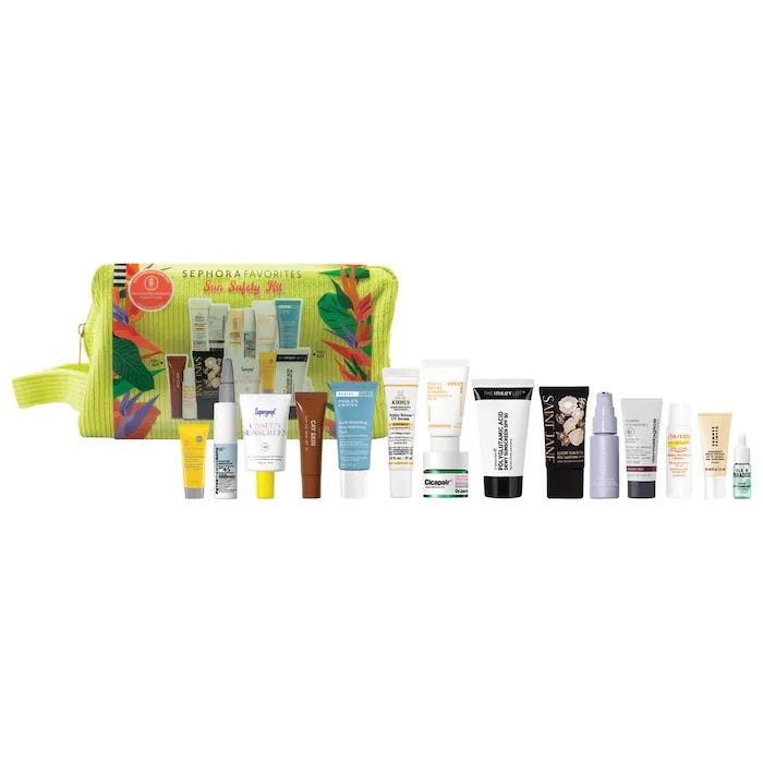 A variety of skincare items displayed next to a yellow cosmetic bag with a tropical leaf design.