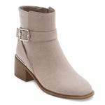 A beige ankle boot with a strap and buckle detail and a block heel.