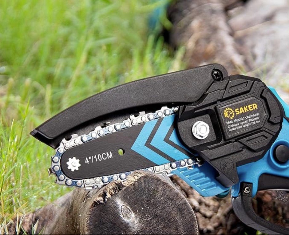 A mini electric chainsaw with a blue and black handle and a chain length of approximately 10 cm.