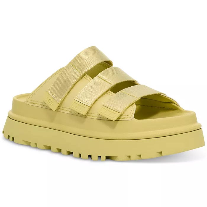 Yellow slide sandal with three adjustable straps and a chunky treaded sole.