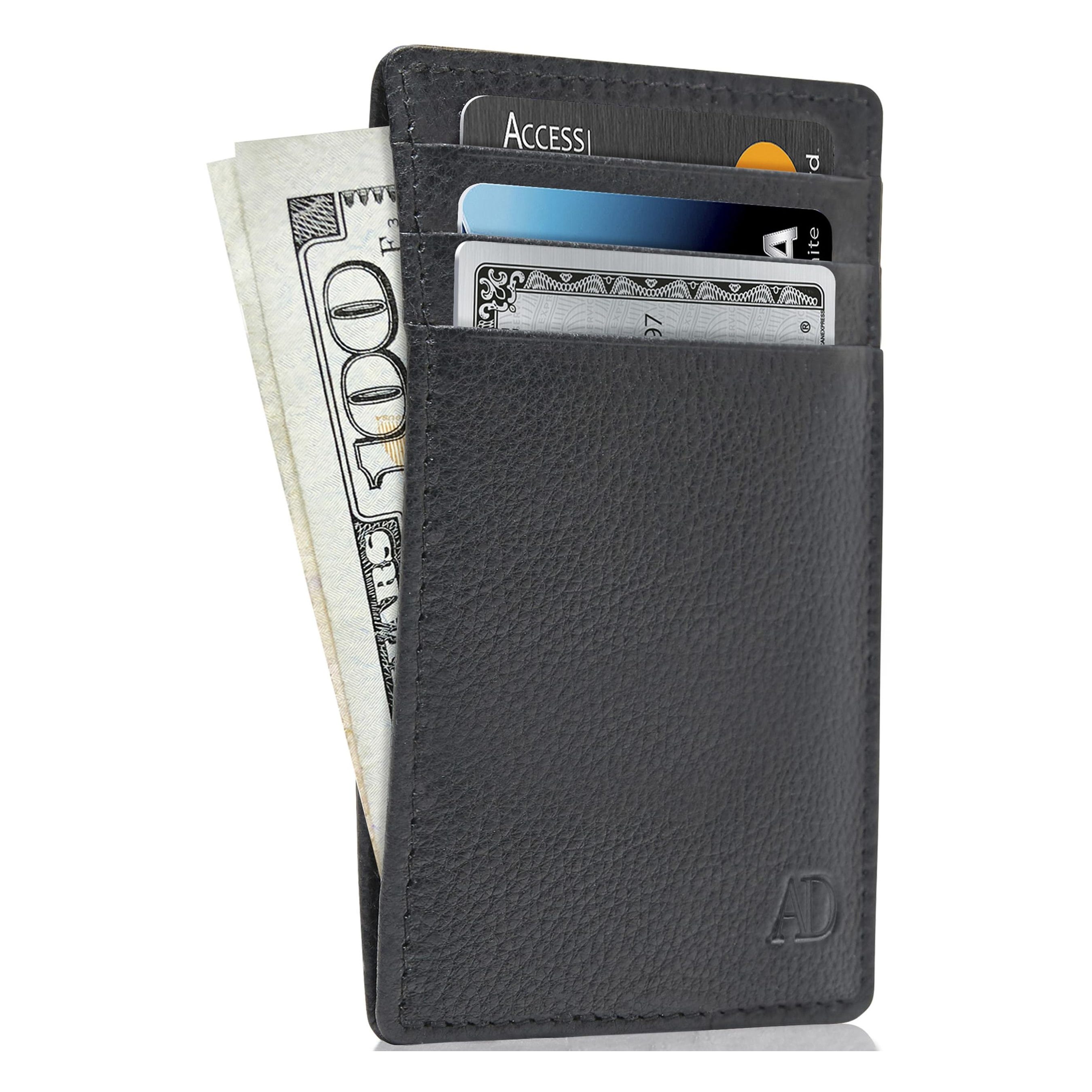 A slim leather card holder with slots containing cards and cash visible.