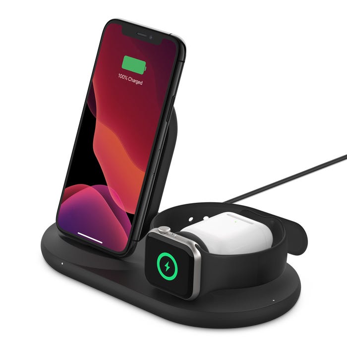 A smartphone and smartwatch are charging on a dual wireless charging stand.
