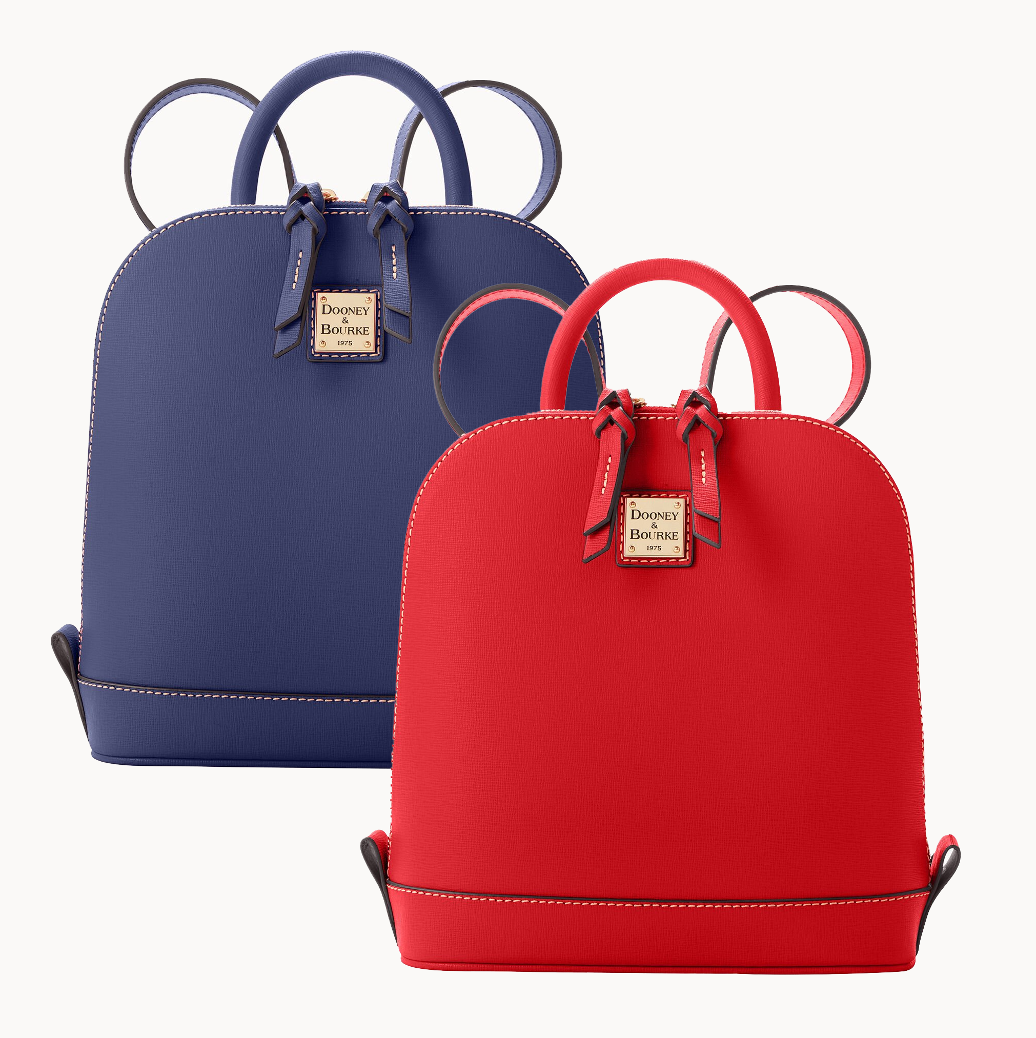 Two leather backpacks, one blue and one red, with top handles and branding tags.