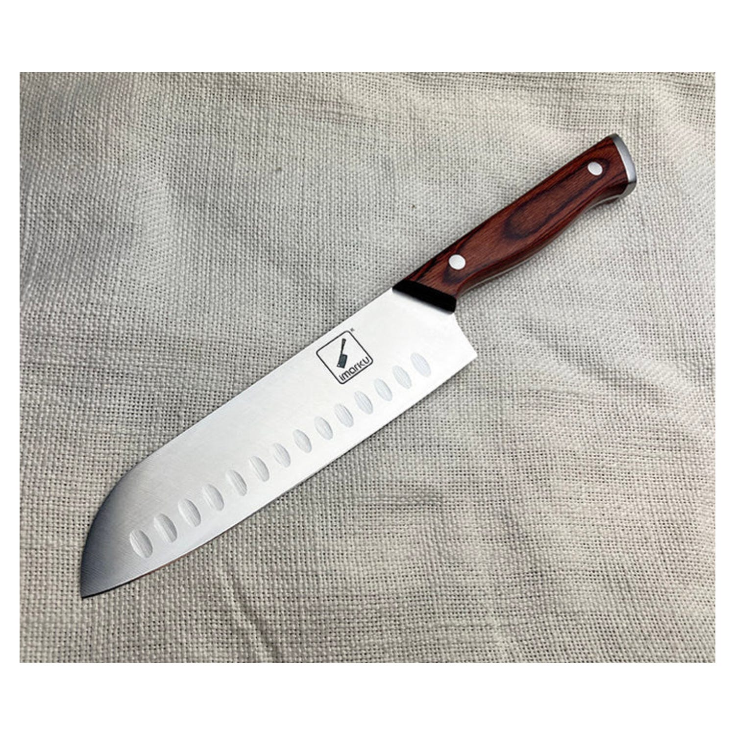 A Santoku knife with a wooden handle and a stainless steel blade featuring hollow indents.