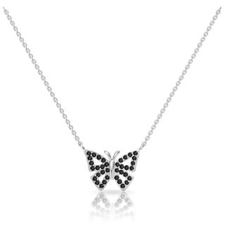 Silver butterfly pendant necklace with black gemstone accents on a chain, reflected on a surface.