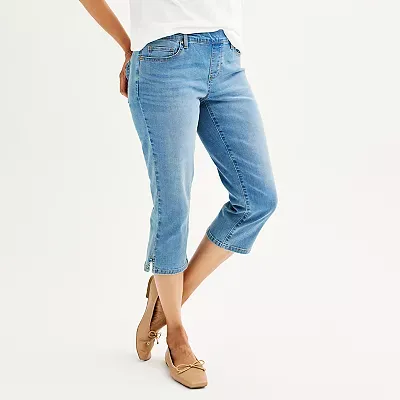 Light blue denim capris with cuffed hems, paired with tan loafers.