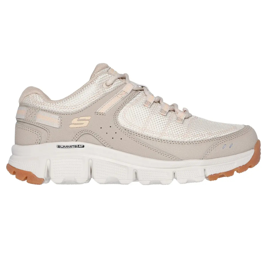 Skechers Artist Bluff Sneakers feature a beige and white mesh design with synthetic overlays, a cushioned collar, and white rubber soles with gum accents. They have lace-up closures and the Skechers \“S\“ logo on the side.