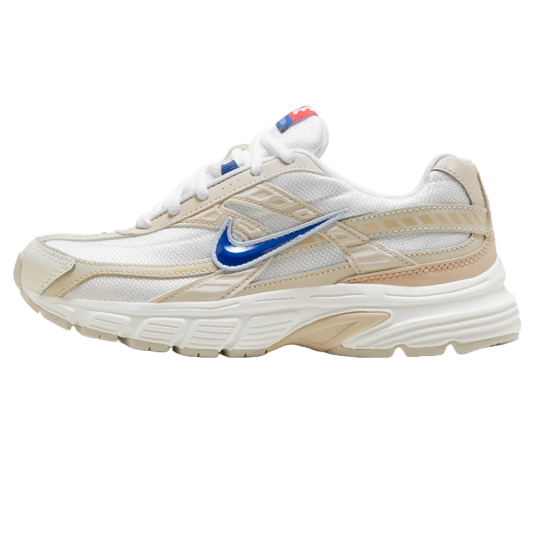 Nike Women's Initiator Shoes feature a mesh upper with beige overlays, a blue metallic Swoosh, and a cushioned white midsole for enhanced comfort and ventilation.