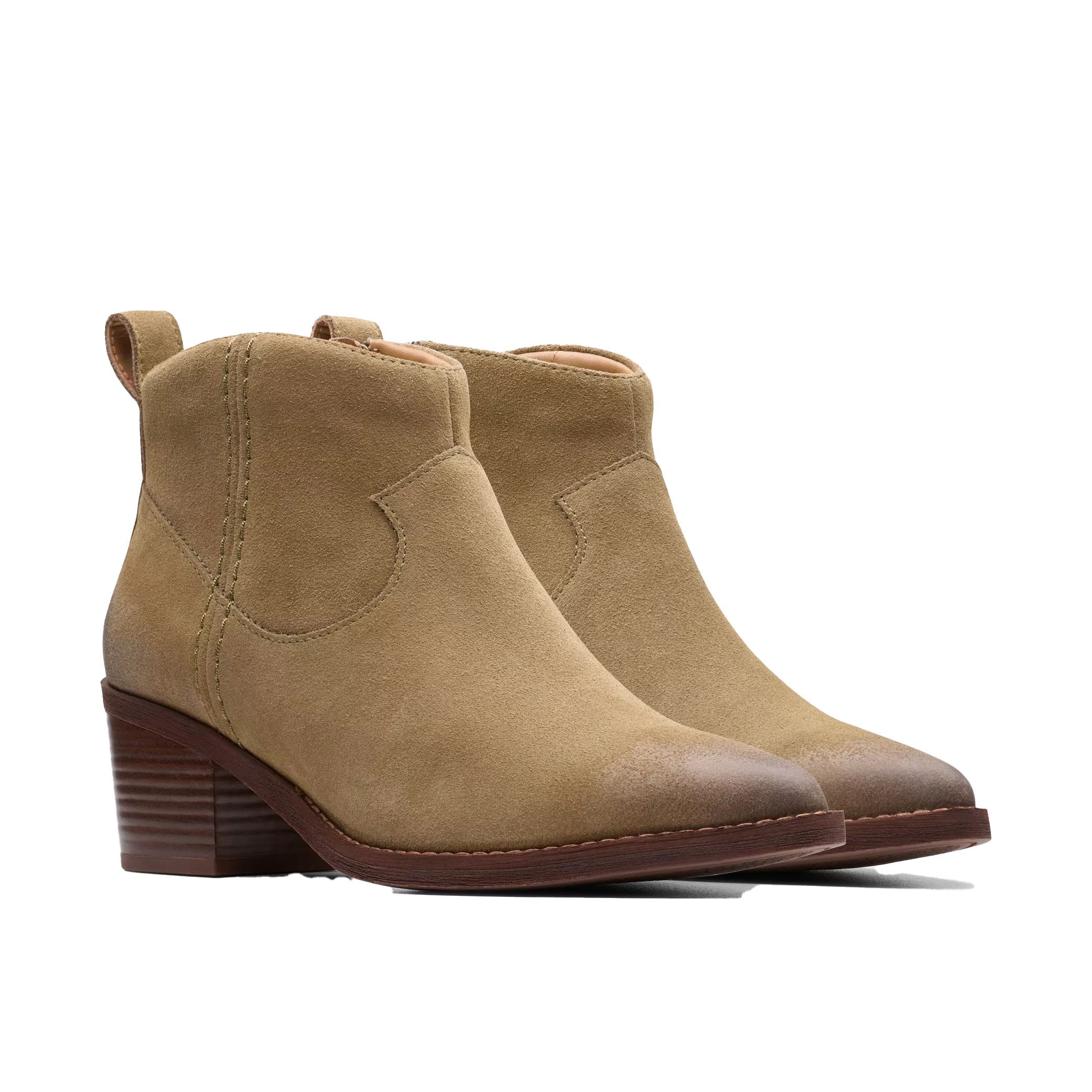 Clarks Morzine Sky Ankle Boots feature a tan suede upper with a smooth texture, a round toe, and a block heel for added comfort. They have a side pull tab and visible stitching, offering a stylish, casual look.