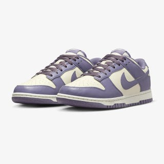 A pair of purple and white low-top sneakers.
