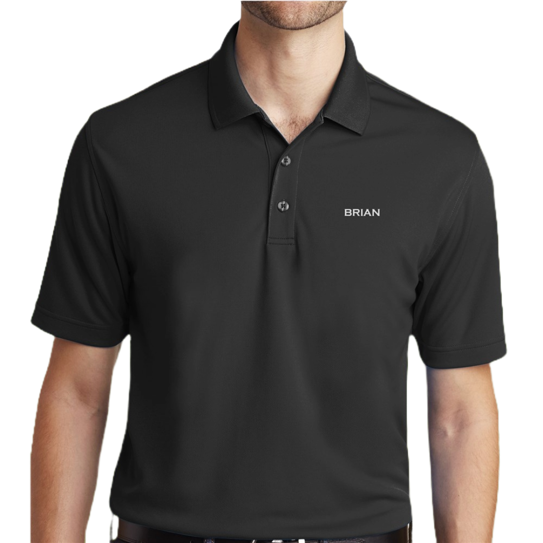 A black polo shirt featuring a buttoned collar and short sleeves, with the name \“Brian\“ embroidered in white on the chest.