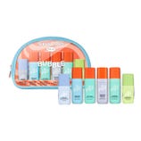 The Bubble Super Cuties Skincare Kit includes travel-sized bottles: Water Slide, Fresh Start, Soft Launch, and Cloud Surf with orange caps, and Slam Dunk and Morning Safe with green caps, all packaged in a transparent zippered pouch.