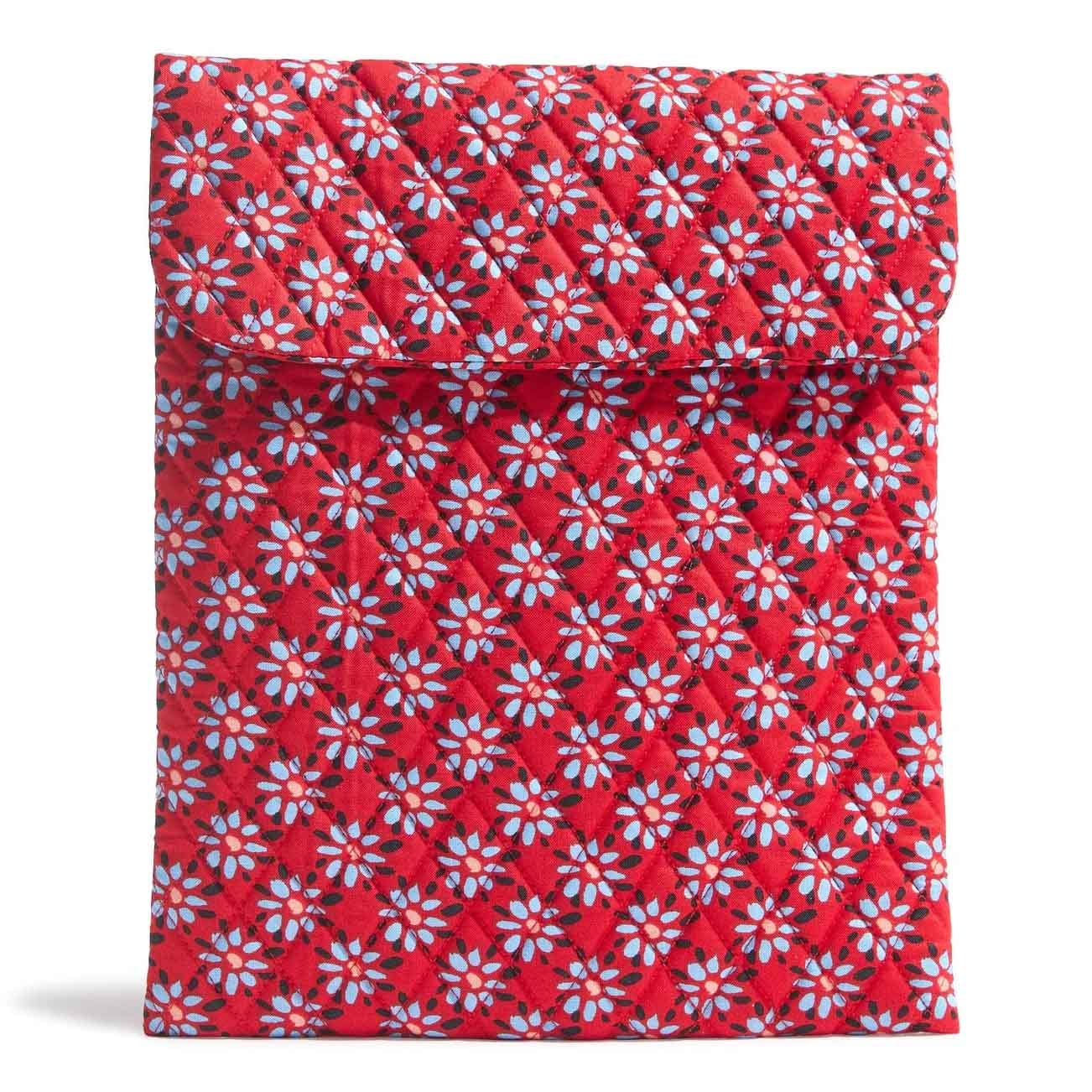Red quilted fabric sleeve with a blue and white daisy pattern, designed for small tech devices. Features a flap closure and a compact, padded design.