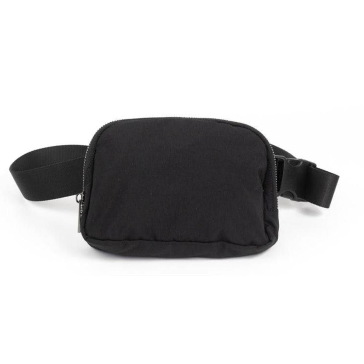 Black nylon crossbody waist pack with a rectangular shape, featuring a zippered main compartment and an adjustable strap with a buckle closure.