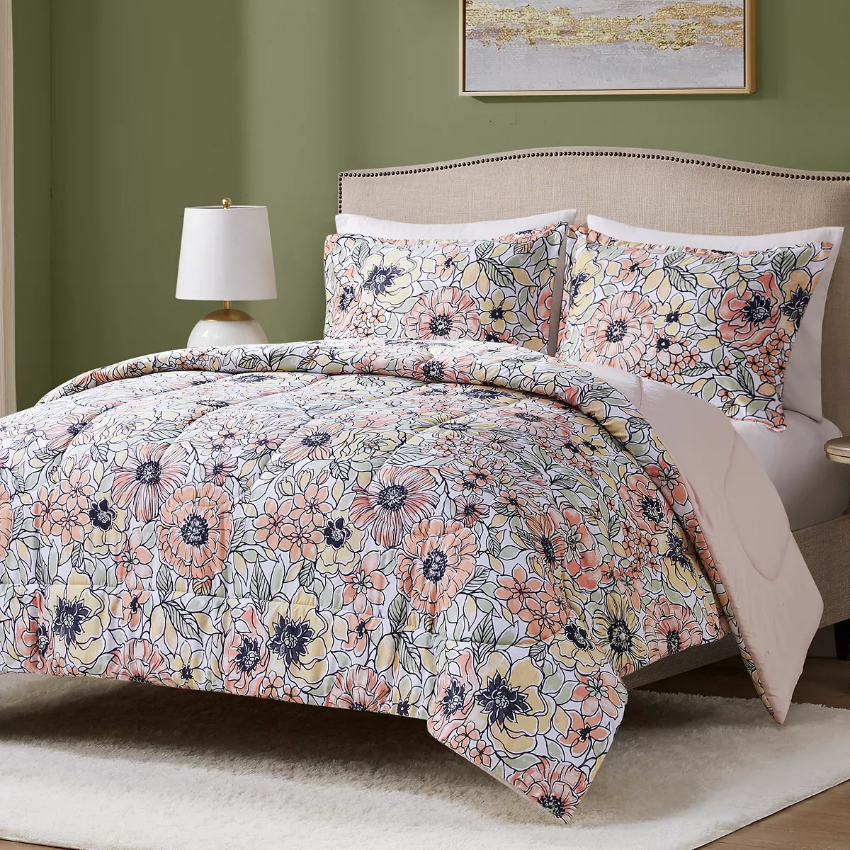 Floral patterned bedding set with duvet cover and pillowcases on a bed.
