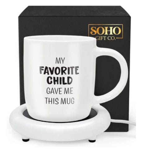 White mug with the text \“MY FAVORITE CHILD GAVE ME THIS MUG\“ accompanied by an electric warmer. Packaged by Soho Gift Co.