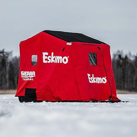 Red Eskimo Sierra Thermal portable ice fishing shelter on snow.