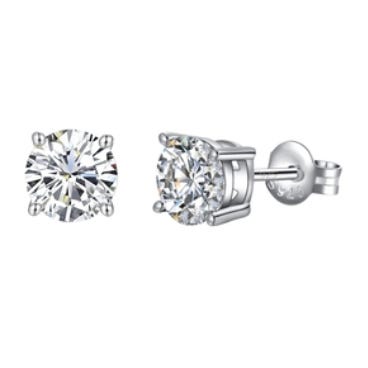 A pair of round-cut diamond stud earrings set in a four-prong silver setting, with screw-back closures.