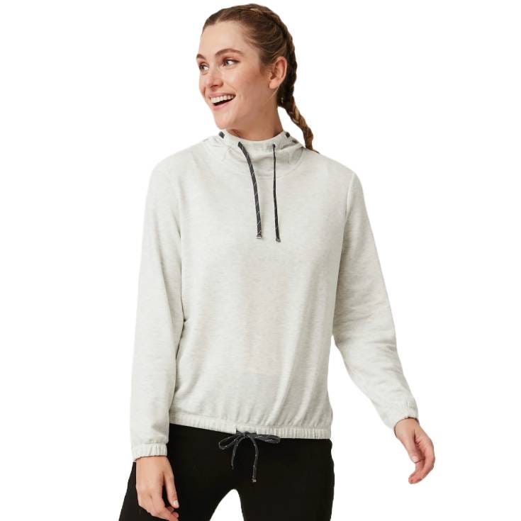 A woman wears a light gray pullover with a drawstring high collar and hem, paired with black pants. The pullover features long sleeves and a relaxed fit, offering a casual, sporty look.