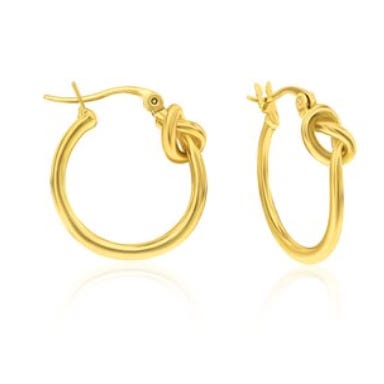 Gold hoop earrings with a knot design near the clasp.