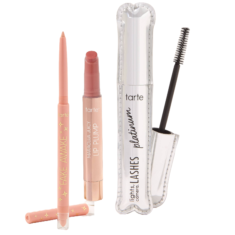 The Tarte Cosmetics 3pc Trending Trio includes a Fake Awake nude eyeliner, Maracuja Juicy Lip Plump in a soft pink shade, and Lights, Camera, Lashes platinum mascara, offering products for eyes and lips in a compact set.