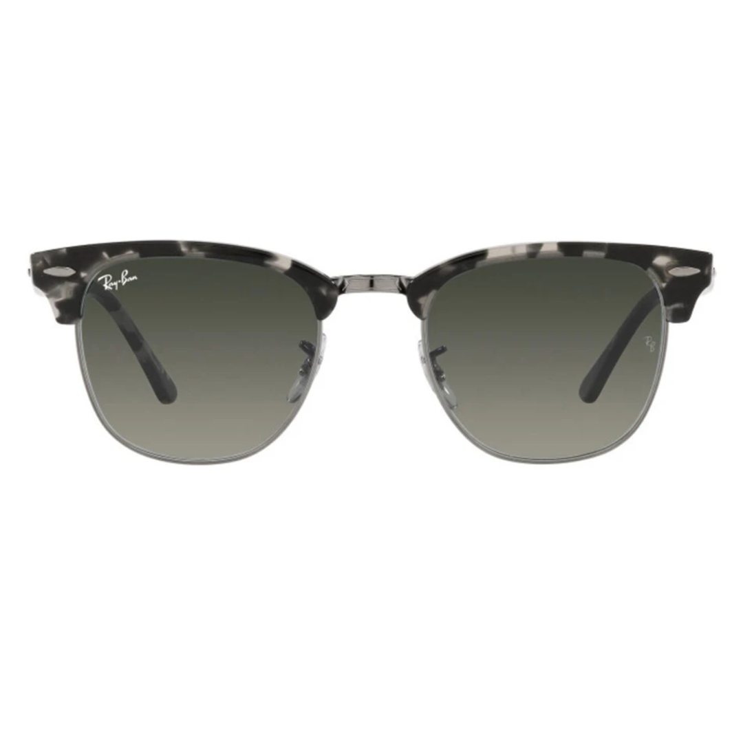 Ray-Ban Clubmaster sunglasses with black and white marbled browline, green gradient lenses, and metal bridge and rims. Signature logo visible on the upper corner of the lens.