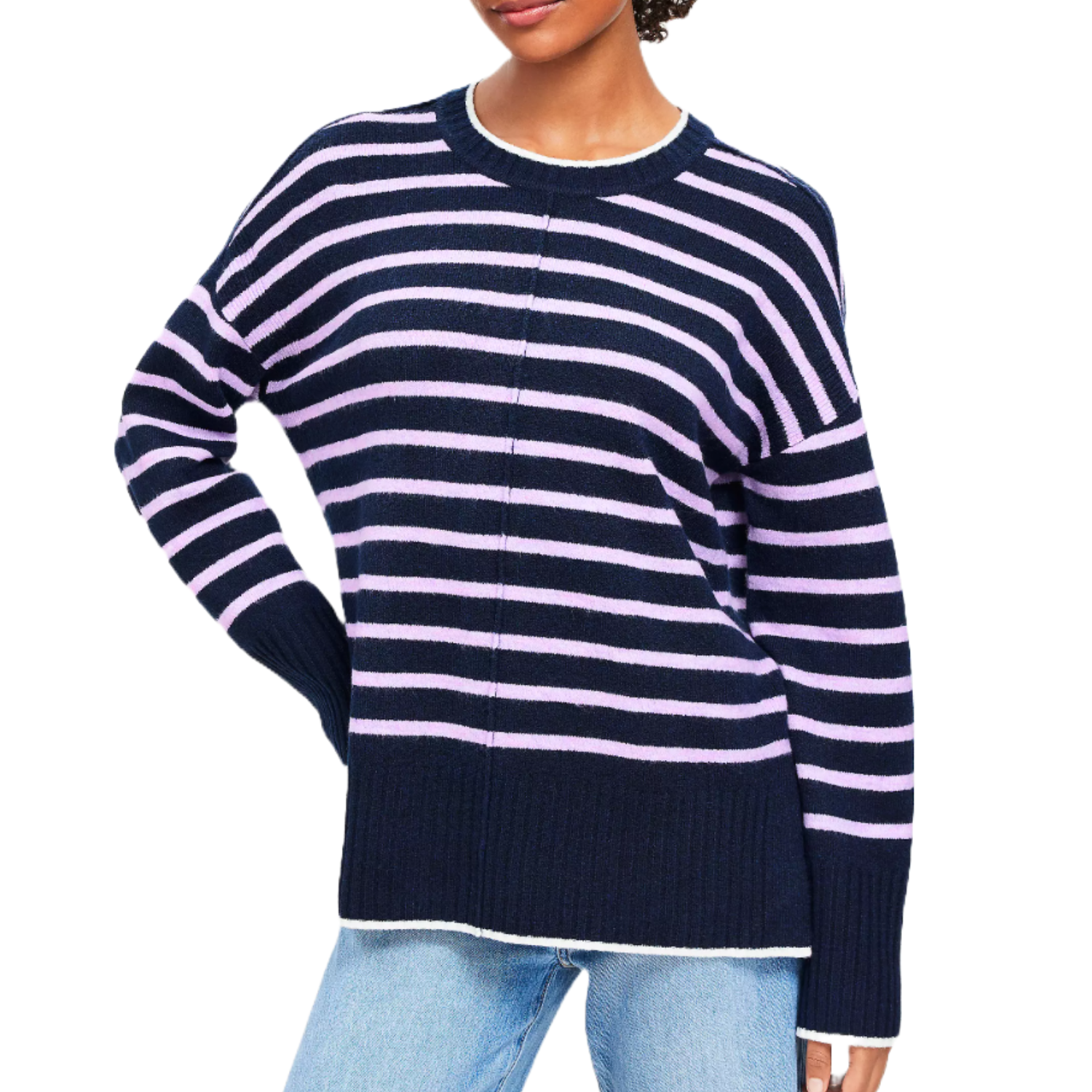 A woman is wearing a navy and lilac striped LOFT sweater with a crew neckline and long sleeves, paired with light blue jeans.