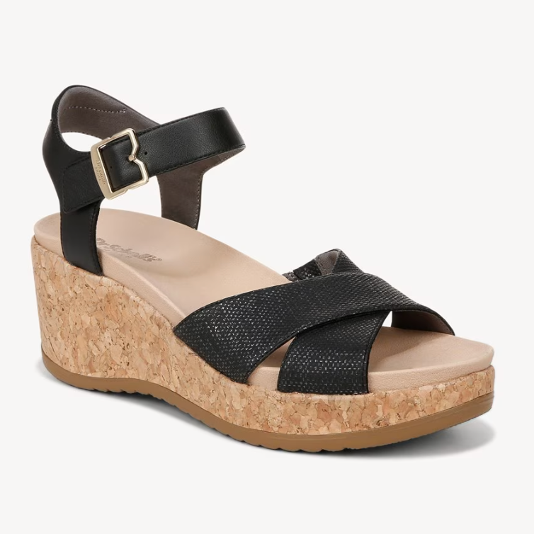 Black ankle-strap cork wedge sandal with a textured upper strap.