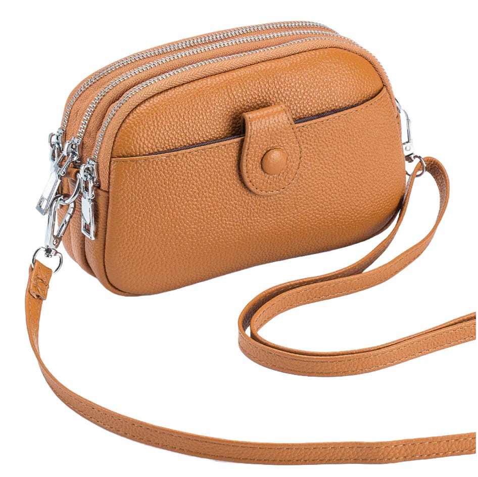 A small brown leather crossbody bag featuring three zippered compartments, a front pocket with a snap button, and an adjustable strap.