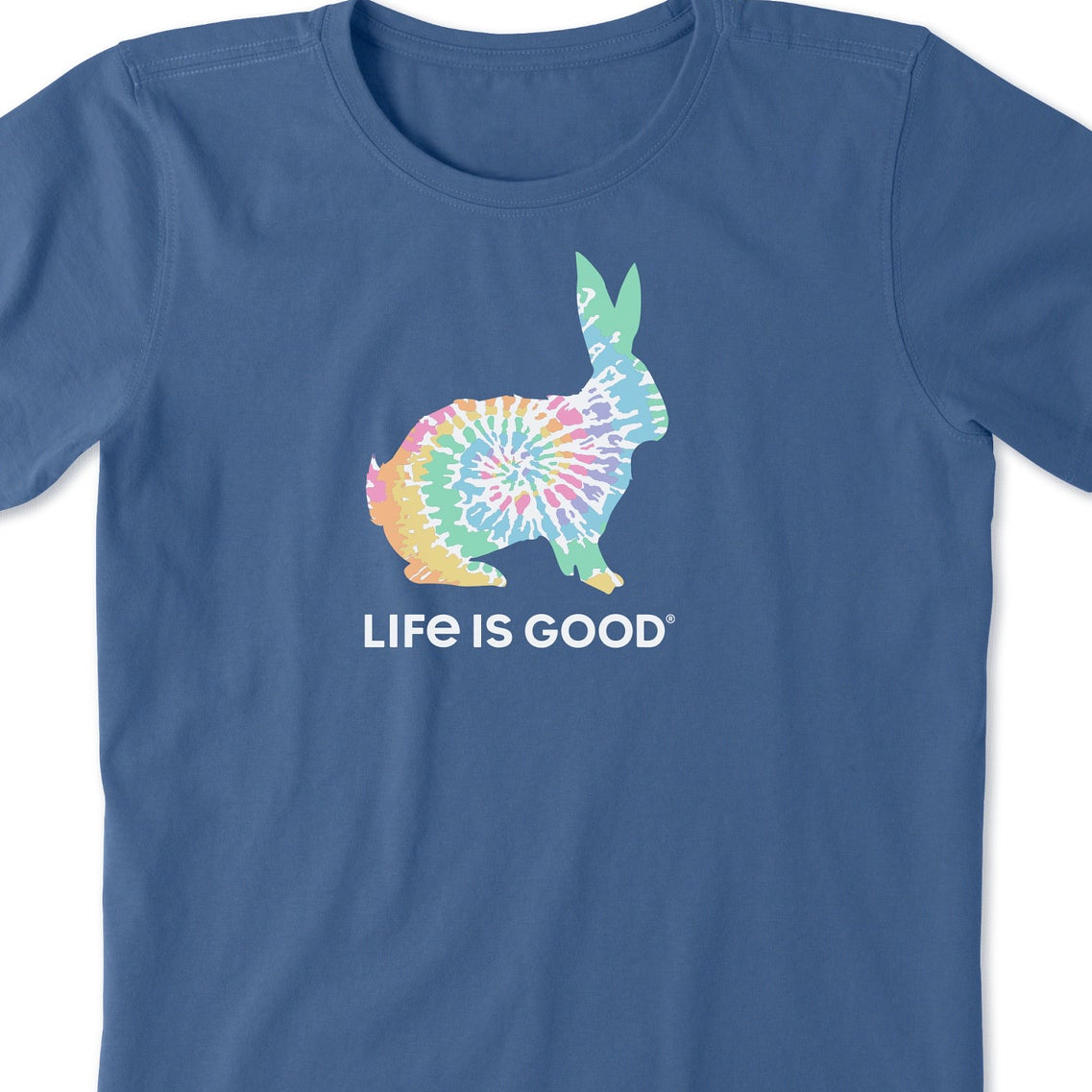 Blue T-shirt featuring a colorful tie-dye silhouette of a bunny above the text \“LIFE IS GOOD.\“