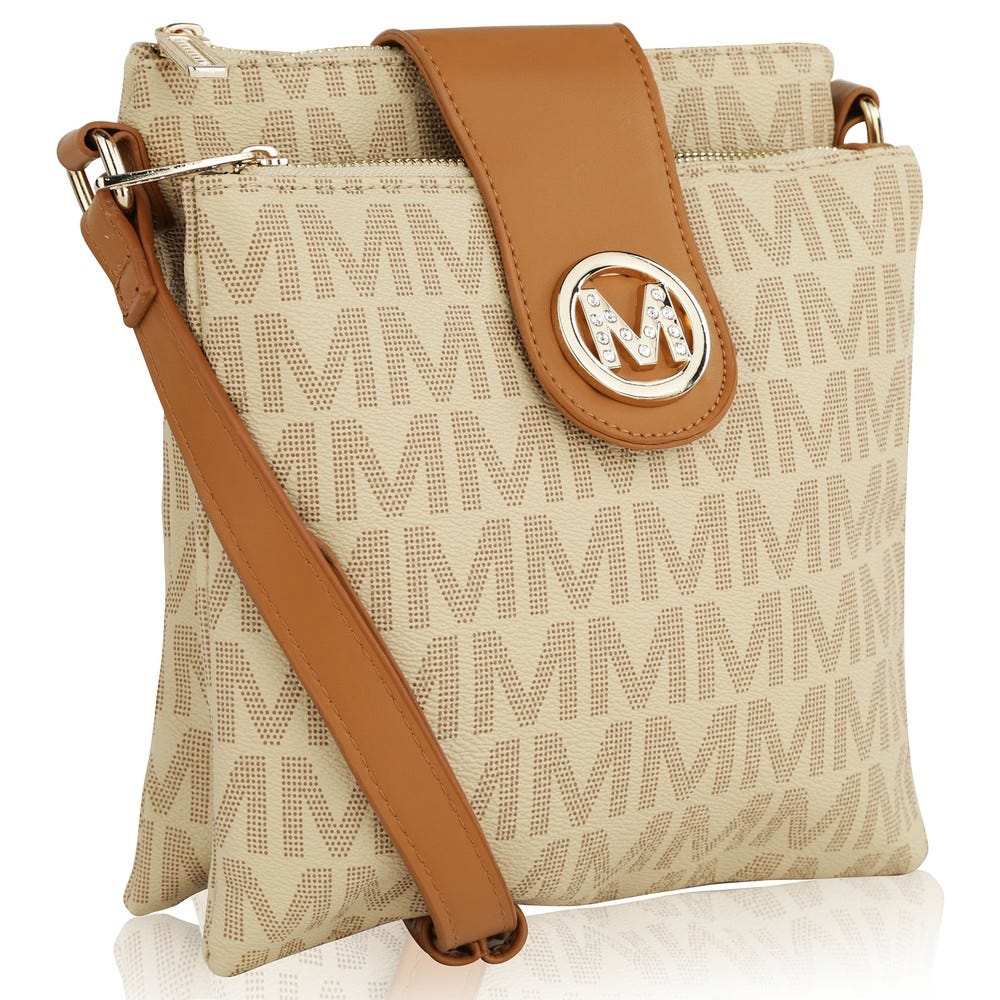 A tan crossbody bag featuring a patterned \“M\“ design, brown leather strap, and a clasp with a metallic \“M\“ logo embellished with rhinestones.