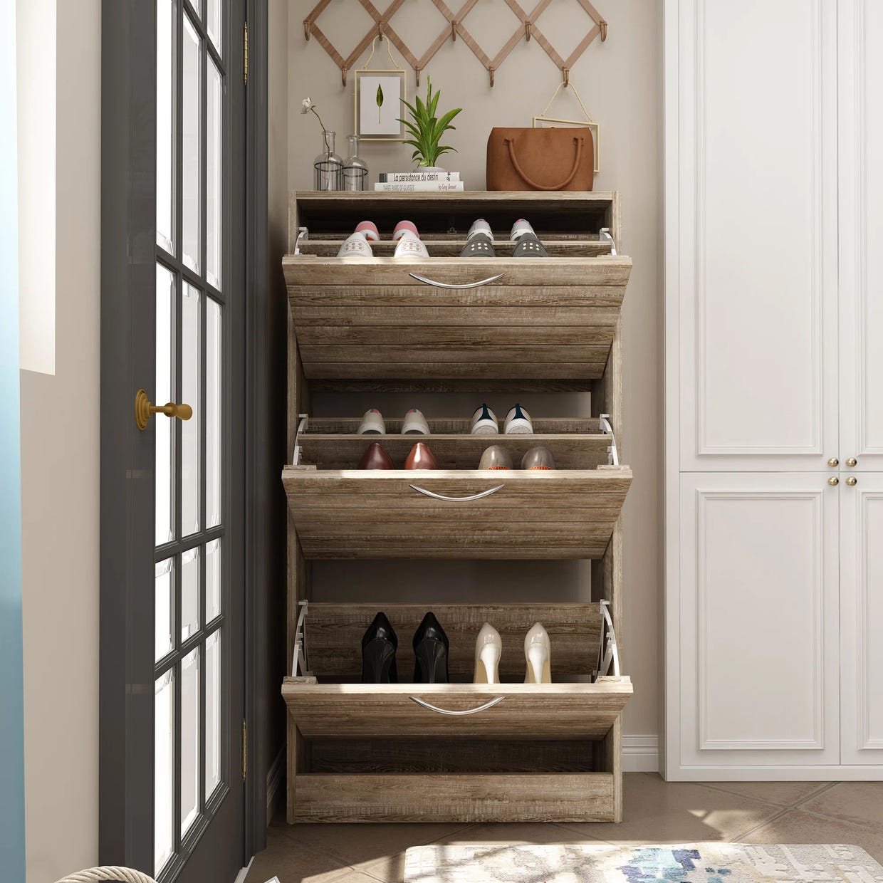 Wooden shoe storage cabinet with pull-out drawers, displaying various pairs of shoes inside.
